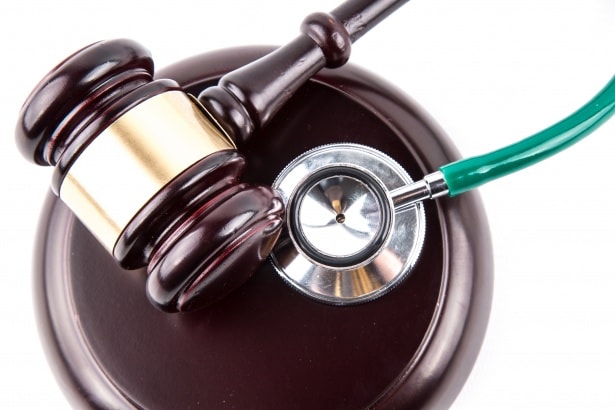 A judge's gavel next to a stethoscope