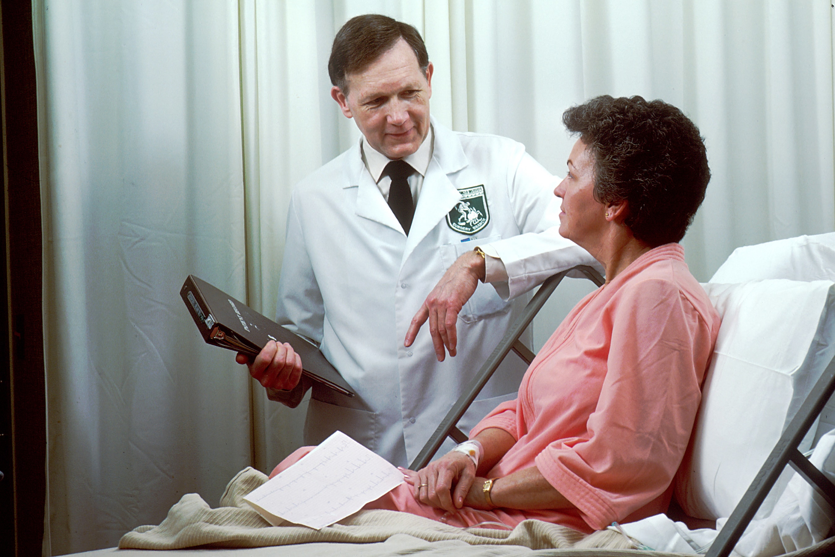 Doctor speaking with a woman in a hospital